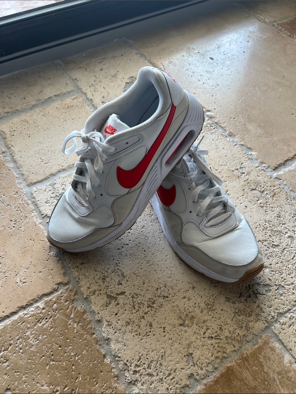 Nike White Sneakers with Red Swoosh Accents